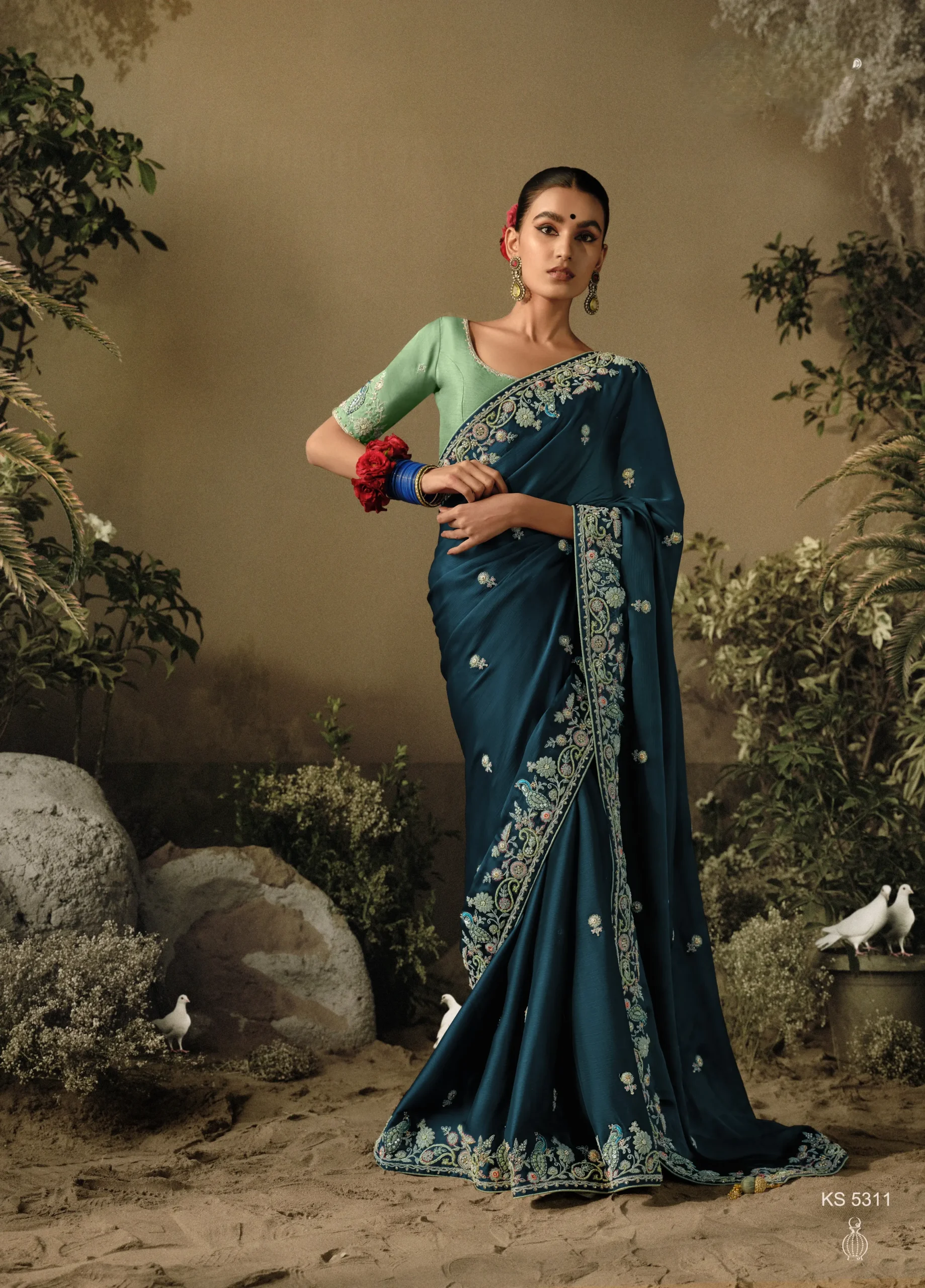 Blue Embroidered Designer Dola Silk Saree: A Regal Choice